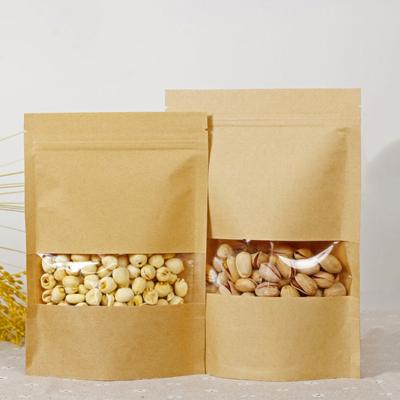 China Moisture Proof Chinese Fabrics Clear Window Zipper Kraft Paper Holder Up Pouch Packaging Bags for sale