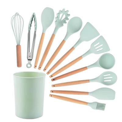 China 12 pieces workable wooden silicone kitchenware handle silicone cookware kitchenware set with rack for sale