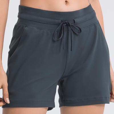 China Breathable Women's Drawstring Waist Yoga Shorts Fitness Running Three Quarter Pants for sale