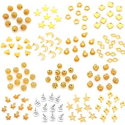 China TRENDY Cute Tiny Bracelet Charms Pendant Diy Jewelry Accessories Gold Plated Round Flower Moon Star Heart Beads For Jewelry Making for sale