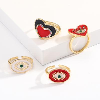 China FASHIONABLE Evil Blue Eye Heart Jewelry Rings Women and Men Gold Plated Trendy Style Adjustable Zircon Rings for Couples for sale