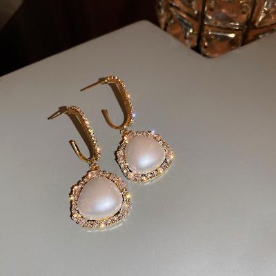 China 2021 New Heavy Tide Fashionable Heavy Industry Fan Goddess Femininity Earrings Light Luxury Sense for sale