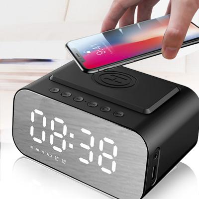 China Wireless Charger For Mobile Phone New Design Radio Charging Blue Tooth Speakers FM Radio Alarm Clock Microphone Charger Speaker for sale