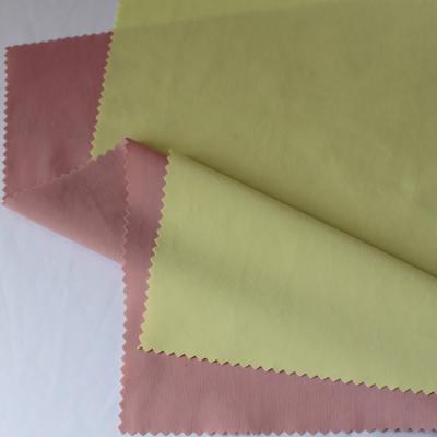 China Stain 4 Way Repellent 160gsm Breathable Nylon Spandex 76% 24% Average Weight Knit Warp Fabric For Garment for sale