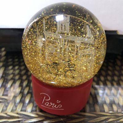 China Custom Europe Acrylic Sheet Inside Love Story Glitter Paris Souvenir Water Glass Snow Globe With Resin Base for sale