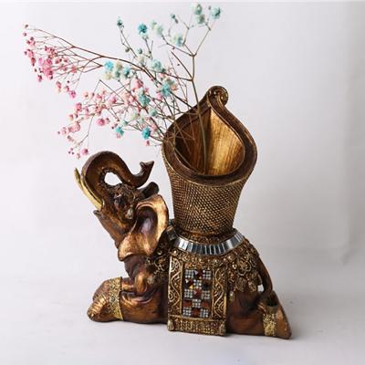 China Asia wholesale tabletop resin lying elephant with vase statue decoration home decoration for sale