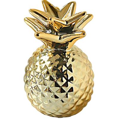 China Eco-friendly personalized decorative gold ceramic European style home pineapple piggy bank ornament for sale