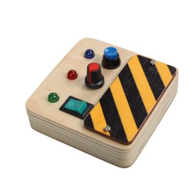 China Wooden Activity LED Light Toy Switch Box Kids Sensory Busy Board Baby Busy Board Toy for sale