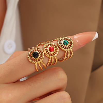 China Punk Cavity Adjustable Natural Stone Gold Plated Rings Stainless Steel Eyes Open Finger Ring For Woman for sale