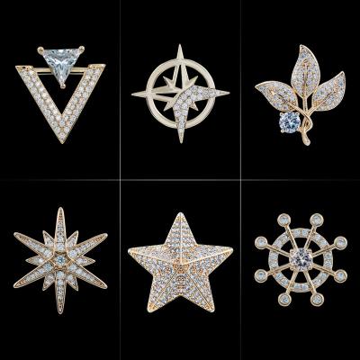 China Trendy Mens Fashion Small Cross Starlight Brooch Plated With Real Gold Micro-Inlaid Zircon Suit Rudder Collar Pin High End Buckle for sale