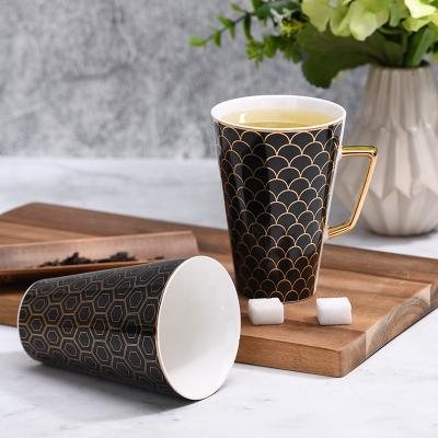 China Sustainable V Shape Ceramic Coffee Tea Mugs Black And Gold Printing Mug With Gold Handle for sale