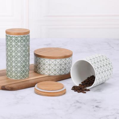 China Viable Customized Airtight Tea Sugar Coffee Food Storage Porcelain Canister Set With Wooden Cover for sale