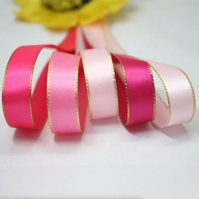 China Cheap Wholesale Christmas Supply 25mm Double Face Satin Polyester Satin Ribbon With Gold Thread Edged for sale