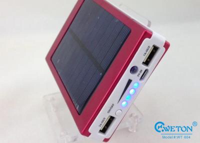 China banco portátil rojo de la energía solar de 10000 mAh, cargador energía solar del teléfono celular con la antorcha en venta