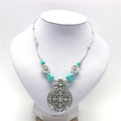 China Custom Vintage Alloy Jewelry Bohemia Turquoise Hollow Out Flower Women Fashion Pendant Necklace for sale