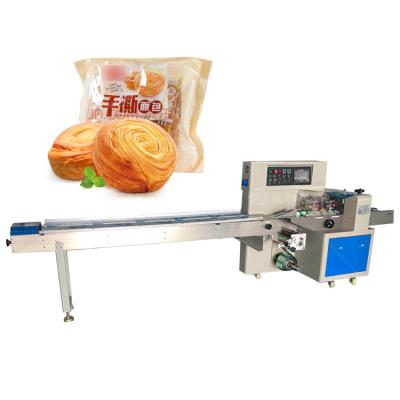 China Vlekvrye staal horizontale volledig automatische brood groente kussen verpakkingsmachine voor pizza Te koop