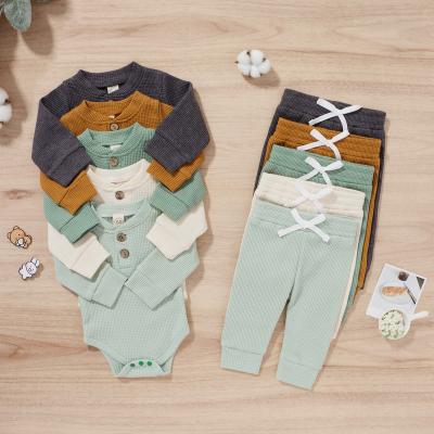 China Casual Newborn Baby Boy Girl Clothes Cotton Long Sleeve Romper Long Pants Solid Color Autumn Winter Ribbed Knitted Outfits for sale