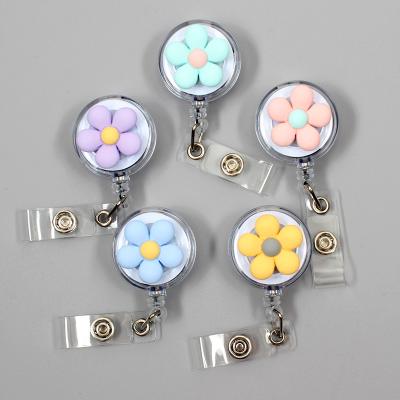 China Creative Flower Resin Color Office Candy Badge Reel Nurse Doctor Student ID Retractable Card Cuts Badge Holder for sale