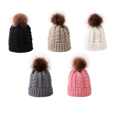 China Solid Color COMMON Promotional Cable Knitted Acrylic Winter Bobble Warm Hats and Caps for Ladies for sale