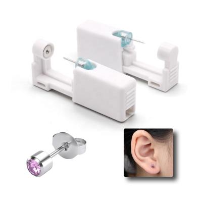 China Romantic Ear Piercing Gun with Pink Crystal Studs Personal Ear Piercing tool kit Painless Ear Piercer Disposable for sale