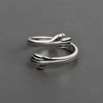 China Lead Free Nickel Free Hot Selling Creative Romantic Hands Couple Rings Jewelry Love Embrace Opening Adjustable Rings for sale