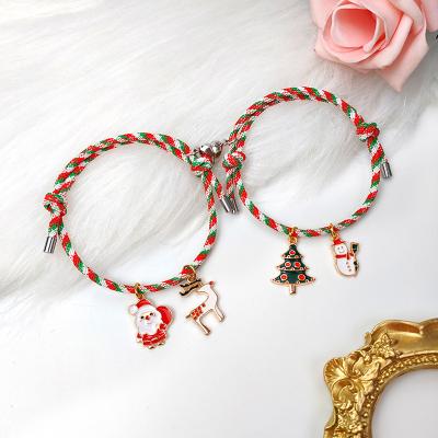 China Environmental Friendly New Arrival Merry Christmas Lucky Snowflake Magnetic Woven Bracelet For Couples for sale