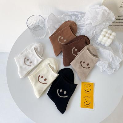 China Best Selling QUICK DRY Socks For Women Custom Designer Funny Smile Face Tube Socks for sale