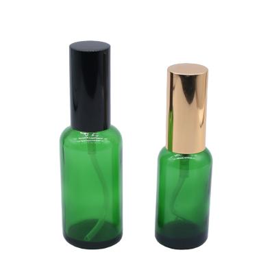 China Low Price Cosmetic Bottle Green Glass Perfume Spray Bottle 10ml Green Essential Oil Bottle for sale