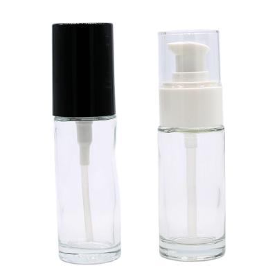 China Luxury Custom Round 30ml Empty Clear Upright Cosmetics Packaging Face Foundation Liquid Bottle With Black Pump Cap for sale