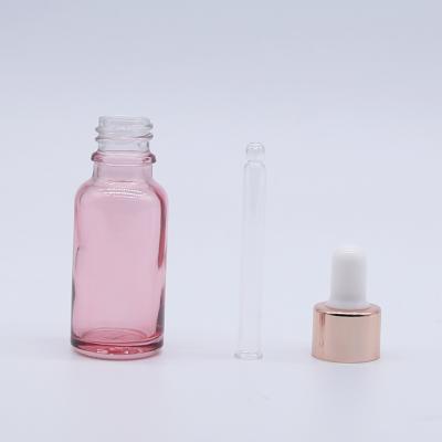 China Wholesale hot sale cosmetic essential oil factory produced glass bottle with dropper rose gold lid for sale