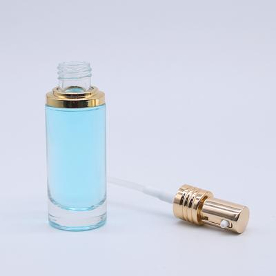 China Aluminum Shoulder Sleeve Dropper Bottle Press Dropper Bottle 30ml 1oz Clear Serum Luxury Round Glass Bottle Personal Care for sale