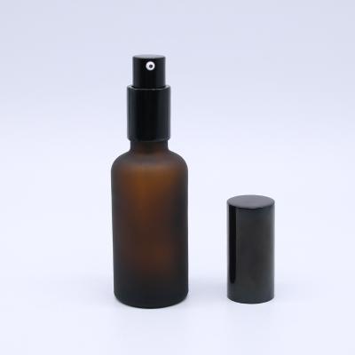 China Cosmetic Amber Scrub Spray Bottle 100ml Water Bottle Refined Oil Pump Head Glass Brown Bottle for sale