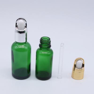 China Wholesale Price Cosmetic Oil Dropper Bottle 30ml 1oz Green Serum Bottle Glass Bottles for sale