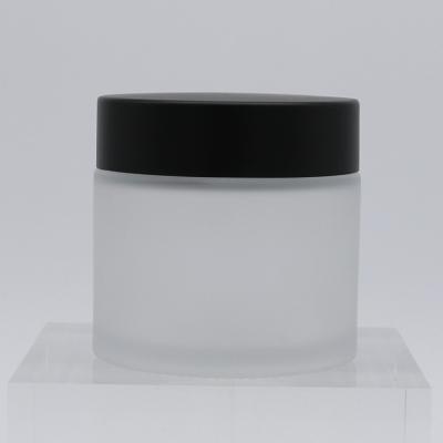 China Straigh Clear 60g Personal Care Glass Cosmetic Packaging Frosted Glass Cream Cosmetic Jar With Matte Black Lid Tangent Silver Matte Lid for sale