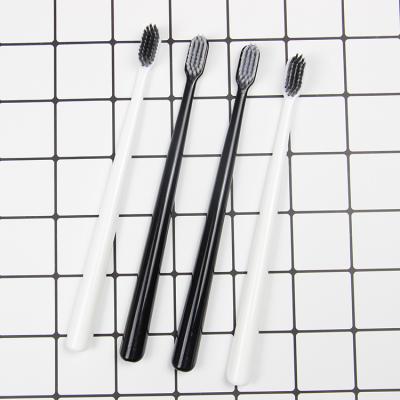 中国 Wholesale Custom Logo White Black Ultra Soft Fine Bristle Bamboo Charcoal Toothbrush For Adult 販売のため