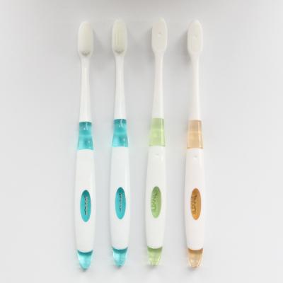 China ultra fine toothbrush home use soft bristle protect gums nano toothbrush Degradable handle for sale