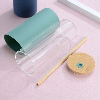 China 450ml Sustainable Glass Drinking Water Bottle With Protective Silicone And Bamboo Sleeve Lid for sale