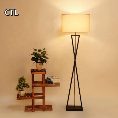 China Modern Nordic Home Decor Standing Floor Lamp Led CE European Black Tripod Hotel Floor Lamp for sale