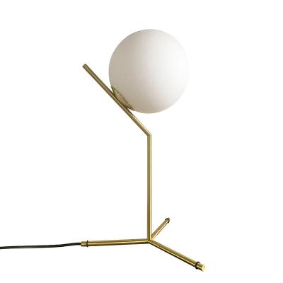 China Modern Creative Bedside Lamp Home Bedroom Decorative Glass Ball Led Desk Lighting Lamp Led Tripod Postmodern Luxury Table Lamp for sale