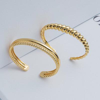 China Environmental Friendly Gold Plated Twist Pattern Bangle Polished Open Adjustable Bangle For Women for sale