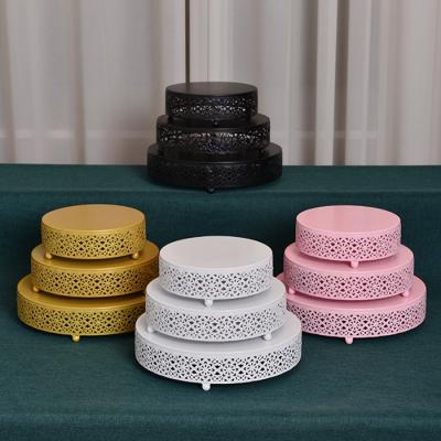 China Viable Set of 3 Pieces European Style Metal Cake Stand Creative Gold Hollow Wedding Props Dessert Stand for Cake Decorating for sale