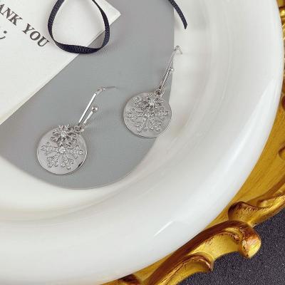 China Feminine and luxury Autumn Winter Round Snowflake Zircon FASHIONABLE high grade cold wind earrings for women for sale