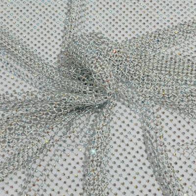 China Shinning Red Iridescent Rhinestones AB Fabric On Black Stretch Net Fabric Spandex Fish Net With Crystal Stones Sold By The Yard for sale