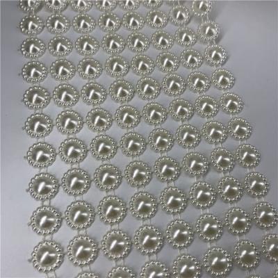 China Flatback 1.3cm High Quality Wholesale Plastic Ribbon Diamond Mesh Packaging Roll 8 Row Pearl Glitter Rhinestone for sale