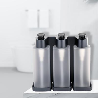 China Heaidea Modern Triple Head Manual Soap Shampoo And Conditioner Dispenser With Refillable Plastic Bottle for sale