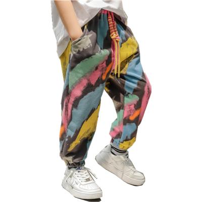 China Custom Anti-Wrinkle Kids Winter Cargo Pants Boys Harem Long Pants Kids Jogger Suits Print Splatter Ink Graffiti Trousers for sale