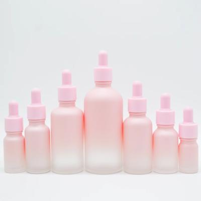 China Wholesale 5ml 10ml 15ml 20ml 30ml 50ml 100ml Cosmetic Empty Gradual Pink Serum Hair Oil Dropper Glass Bottle For Essential Oil for sale