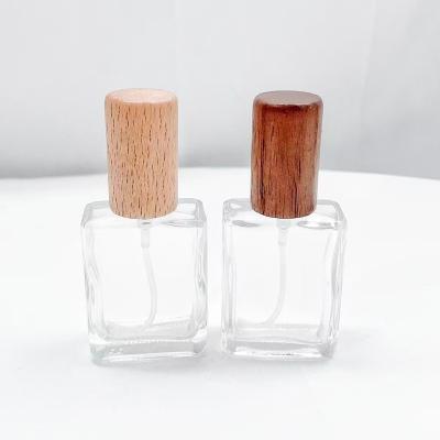 China 15ml New Perfume Bottle Glass Spray Perfume Dispenser Bottle Cosmetic Portable High Grade Lotion Travel Spray Bottle With Wooden Cap for sale