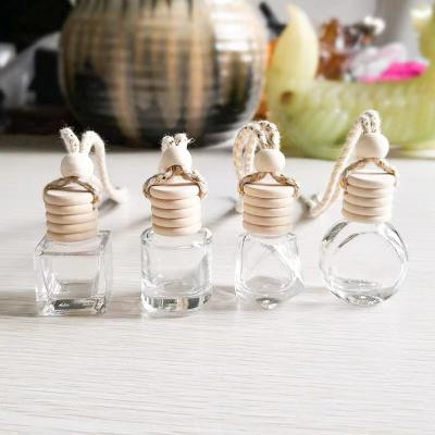 China Wholesale 5ml 8ml 10ml Car Perfume Bottle Car Essential Oil Decoration Cosmetic Hanging Empty Aromatherapy Bottles With Wooden Cap for sale