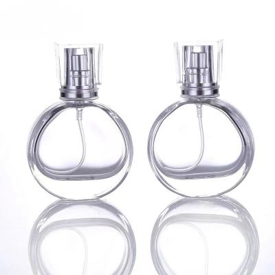 China Original High End Large Capacity Portable Cosmetic 30ml 50ml Round Empty Spray Perfume Bottles With Clear Lids for sale